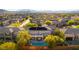 Stunning aerial shot showcasing backyard pool, solar panels, and picturesque neighborhood at 10002 Trapper Mountain St, Las Vegas, NV 89178