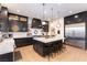 Spacious kitchen with a center island, stainless steel appliances, and custom cabinetry at 10002 Trapper Mountain St, Las Vegas, NV 89178