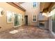 Private patio with fireplace and sliding glass doors offers serene outdoor space for relaxing and entertaining at 10002 Trapper Mountain St, Las Vegas, NV 89178