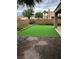 Backyard featuring artificial turf and a brick patio at 1198 Golf Club, Laughlin, NV 89029