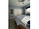 Comfortable bedroom with light blue walls and ceiling fan with light fixture at 1198 Golf Club, Laughlin, NV 89029