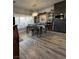 Dining room with cabinets and shelves, wood table, chairs, and a large window with blinds at 1198 Golf Club, Laughlin, NV 89029