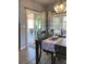 Dining room with a sliding glass door to patio with seating and table at 1198 Golf Club, Laughlin, NV 89029