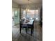 Dining room with wood table, chairs, and modern pendant lighting fixture above at 1198 Golf Club, Laughlin, NV 89029