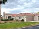 Charming single-story home with well-maintained lawn, desert landscaping, and an attached two car garage at 1198 Golf Club, Laughlin, NV 89029