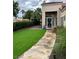Inviting front yard with lush artificial turf and manicured bushes at 1198 Golf Club, Laughlin, NV 89029