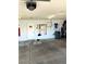 Spacious garage featuring a garage door opener, epoxy floor, and ample storage space at 1198 Golf Club, Laughlin, NV 89029