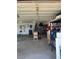 Open garage with storage, work table, and shelving at 1198 Golf Club, Laughlin, NV 89029
