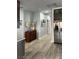 Hallway includes stainless refrigerator, decor, and view into another room at 1198 Golf Club, Laughlin, NV 89029
