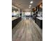 Spacious kitchen with stainless appliances, quartz countertops, pendant lights, and bar seating at 1198 Golf Club, Laughlin, NV 89029