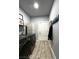 Laundry room with modern washer and dryer, decor, and storage at 1198 Golf Club, Laughlin, NV 89029