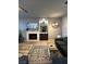 Cozy living room featuring a fireplace, decor, large window, and comfortable seating at 1198 Golf Club, Laughlin, NV 89029