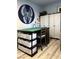 Office/craft space featuring a table with storage and white storage cabinets at 1198 Golf Club, Laughlin, NV 89029