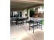 Outdoor patio features table and chairs with a grill, perfect for relaxing or entertaining at 1198 Golf Club, Laughlin, NV 89029