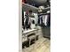 Chic walk-in closet featuring custom organizers, shelves, drawers, vanity area, and ample storage space at 1198 Golf Club, Laughlin, NV 89029