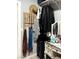 Walk-in closet with hanging rods, shelving, and a built-in vanity area for stylish storage at 1198 Golf Club, Laughlin, NV 89029