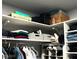 Organized closet space with hanging rods, shelving, and storage boxes for optimal organization at 1198 Golf Club, Laughlin, NV 89029