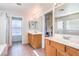 Bright bathroom featuring double sinks and tile flooring, and natural light at 1213 High Altitude Ave, North Las Vegas, NV 89032
