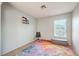 Bright bedroom features a window with blinds and a colorful rug on the carpeted floor at 1213 High Altitude Ave, North Las Vegas, NV 89032