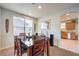Dining area showcases a wooden table with seating, with adjacent kitchen space, perfect for Gathering meals at 1213 High Altitude Ave, North Las Vegas, NV 89032