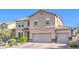 Charming two-story home boasts a tile roof, three-car garage, and manicured landscaping, creating inviting curb appeal at 1213 High Altitude Ave, North Las Vegas, NV 89032