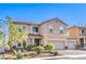 Charming two-story home boasts a tile roof, three-car garage, and manicured landscaping, creating inviting curb appeal at 1213 High Altitude Ave, North Las Vegas, NV 89032