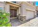 Inviting front entrance features a double door, brick pathway and stonework adding to the curb appeal at 1213 High Altitude Ave, North Las Vegas, NV 89032