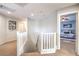 Upstairs hallway with views into a bedroom and other living spaces at 1213 High Altitude Ave, North Las Vegas, NV 89032