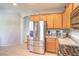 Close-up on stainless steel refrigerator and granite countertops in the kitchen at 1213 High Altitude Ave, North Las Vegas, NV 89032