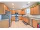 Well-lit kitchen with stainless steel appliances, tiled floors, and granite countertops at 1213 High Altitude Ave, North Las Vegas, NV 89032