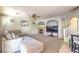 Spacious Gathering room features a comfortable seating area, fireplace, and a large TV, perfect for relaxing and entertaining at 1213 High Altitude Ave, North Las Vegas, NV 89032