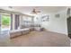 Bright living room featuring a large sectional sofa and sliding glass doors to the backyard at 1213 High Altitude Ave, North Las Vegas, NV 89032