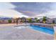 Backyard showcasing the pool, spa, pergola and lush landscaping at 12168 Dorada Coast Ave, Las Vegas, NV 89138