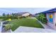 Manicured backyard with artificial turf and lush landscaping at 12168 Dorada Coast Ave, Las Vegas, NV 89138