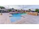 Tranquil backyard featuring a pool, spa, and outdoor kitchen area at 12168 Dorada Coast Ave, Las Vegas, NV 89138