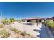 Outdoor oasis featuring a covered patio, a pool, and a spacious stone patio at 12168 Dorada Coast Ave, Las Vegas, NV 89138