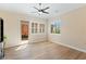 Bedroom with ceiling fan, wood floors, and backyard access at 12168 Dorada Coast Ave, Las Vegas, NV 89138