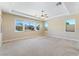 Spacious bedroom with windows, carpet, and trey ceiling at 12168 Dorada Coast Ave, Las Vegas, NV 89138