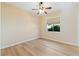 Bedroom with ceiling fan and large window at 12168 Dorada Coast Ave, Las Vegas, NV 89138
