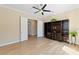 Bedroom with ceiling fan, wood floors and modern storage at 12168 Dorada Coast Ave, Las Vegas, NV 89138