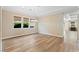 Bright dining room with wood floors, large windows, and elegant chandelier at 12168 Dorada Coast Ave, Las Vegas, NV 89138