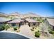 Beautiful single-story home with lush landscaping, stone accents, and a well-maintained front yard at 12168 Dorada Coast Ave, Las Vegas, NV 89138