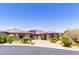 Stunning single-story home with a tile roof, lush landscaping, and mountain views at 12168 Dorada Coast Ave, Las Vegas, NV 89138