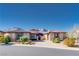 Charming single story home featuring mature landscaping, a brick driveway, and a tile roof at 12168 Dorada Coast Ave, Las Vegas, NV 89138