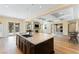 Gourmet kitchen with granite countertops, dark wood cabinets, and pendant lighting at 12168 Dorada Coast Ave, Las Vegas, NV 89138