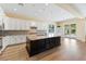 Modern kitchen featuring a large island, white cabinetry, and stainless steel appliances at 12168 Dorada Coast Ave, Las Vegas, NV 89138