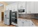 Well-equipped kitchen with stainless steel appliances, custom cabinets, and sleek design at 12168 Dorada Coast Ave, Las Vegas, NV 89138