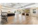 Spacious floor plan with kitchen, fireplace, wood floors, and ample natural light at 12168 Dorada Coast Ave, Las Vegas, NV 89138
