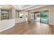 Spacious living area with hardwood floors, open layout, and seamless access to outdoor spaces at 12168 Dorada Coast Ave, Las Vegas, NV 89138