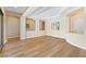 Open-concept living space with hardwood floors, tray ceilings, and ample natural light at 12168 Dorada Coast Ave, Las Vegas, NV 89138
